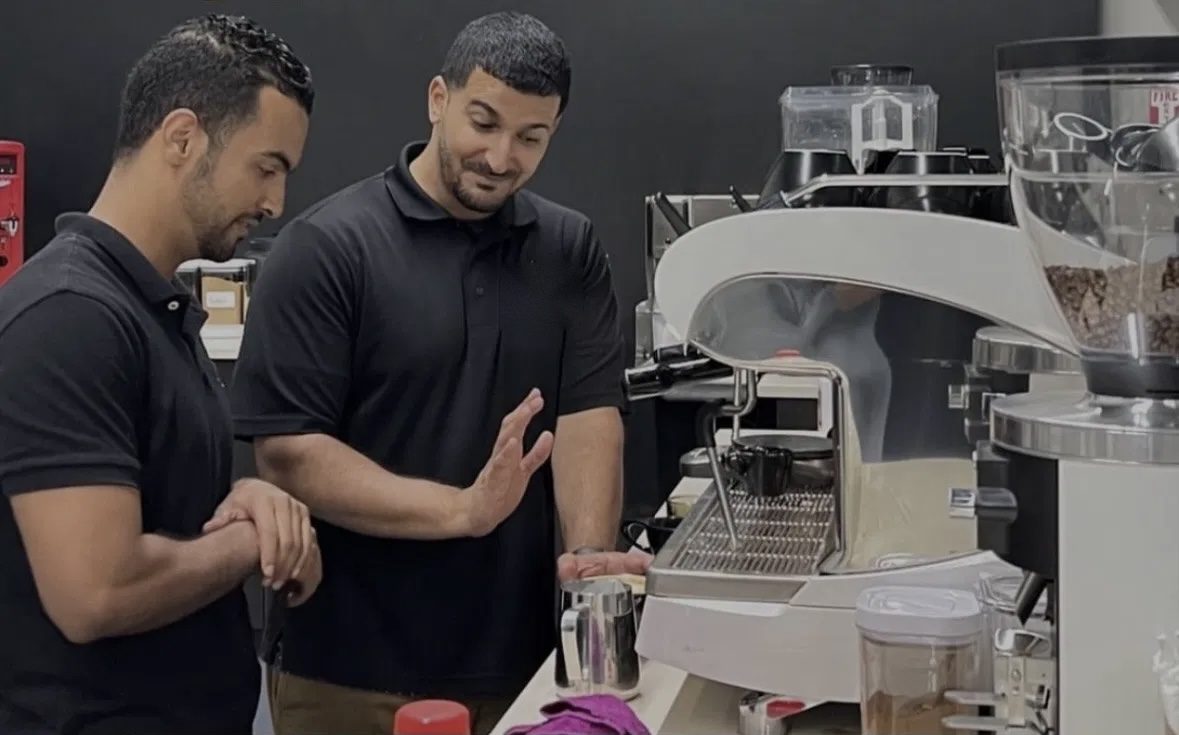 Deen walking a trainee through espresso dial-in on the bar